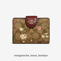 Medium Corner Zip Wallet In Signature canvas IM/Khaki Multi With Wildflower Print